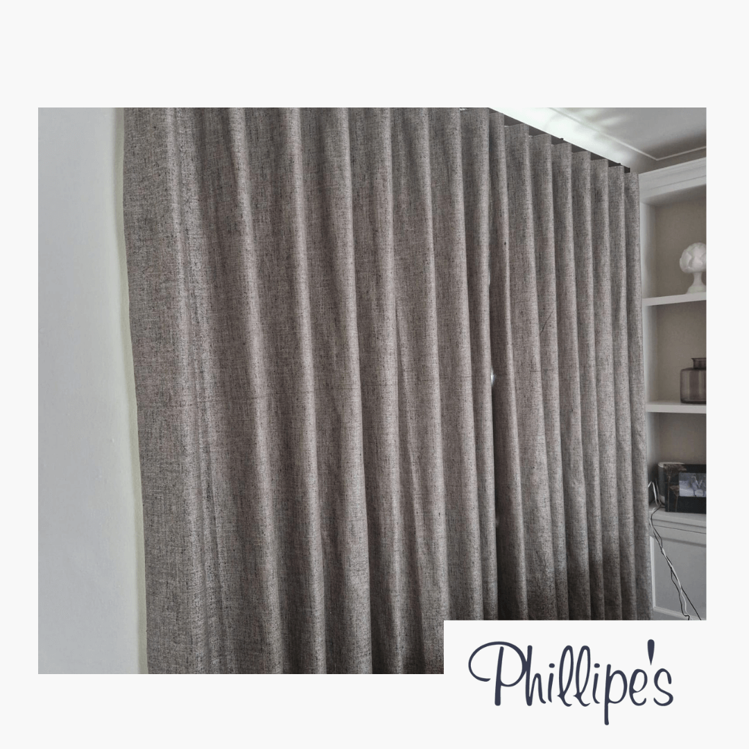 Stunnign long grey panels, freshly hung and crafted from premium fabric